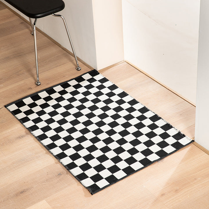 Flat-woven bath mat with abstract geometric pattern