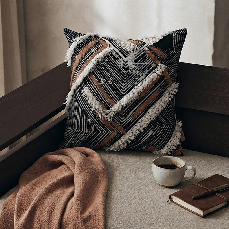 Woven square decorative cushion with fringe application and geometric pattern