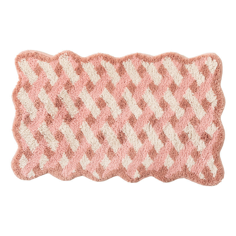 Tufted bathroom runner with wavy hem and relief-style braided pattern
