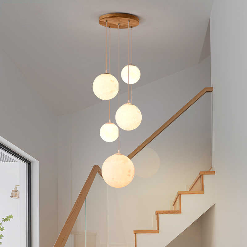 Cascading glass globe pendant lamp with wooden ceiling
