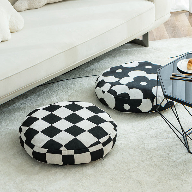 Round decorative seat cushion with floral jacquard structure