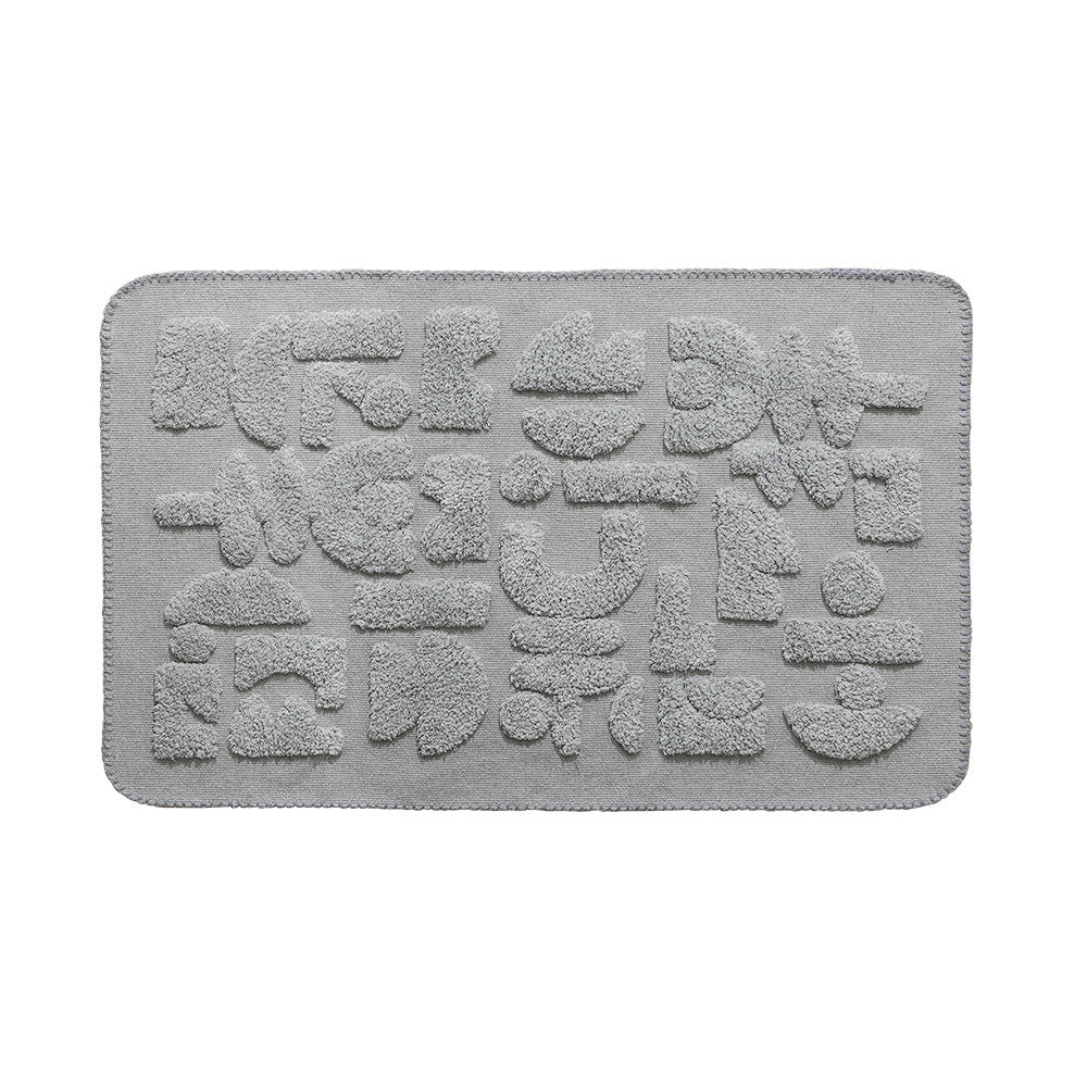 Luxurious organic cotton bath mat with relief pile structure
