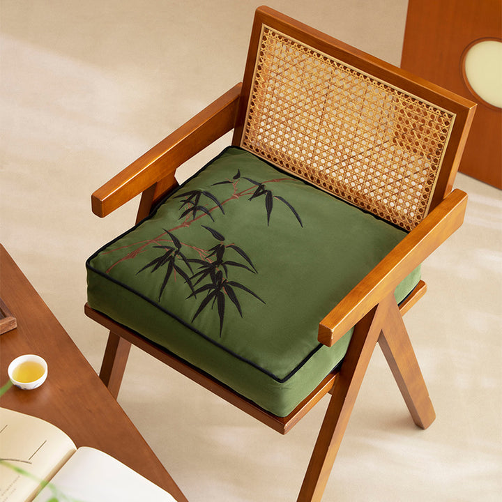 Padded cotton-linen seat cushion with embroidered bamboo motif and contrasting piping