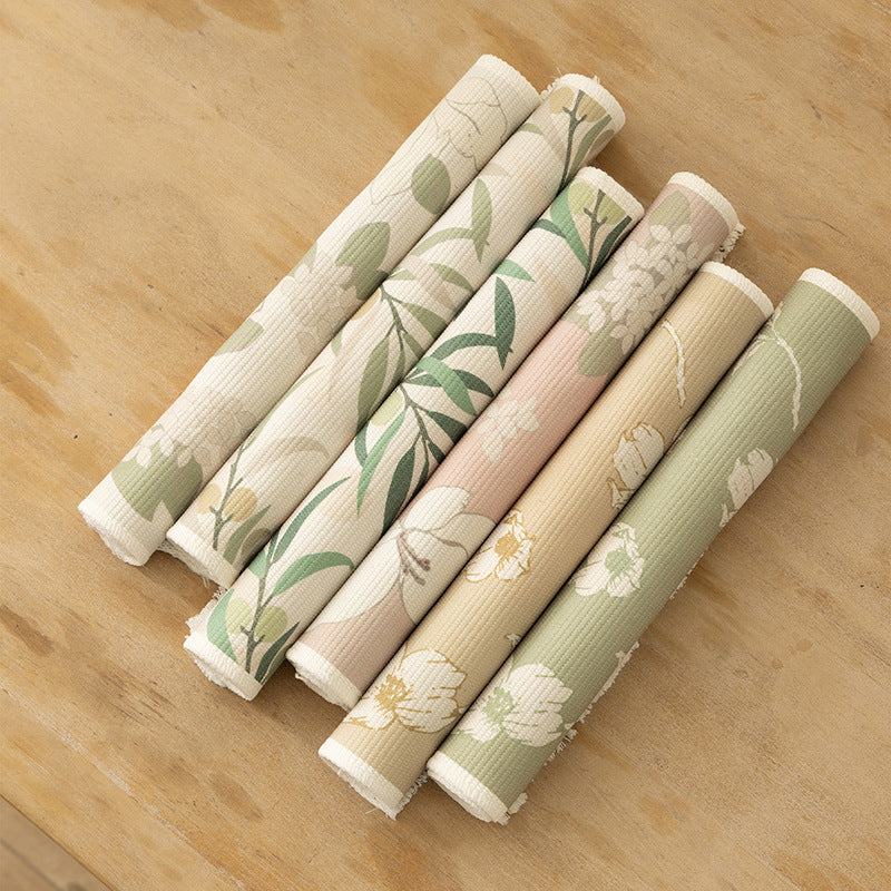 Floral woven bath mat with decorative fringes
