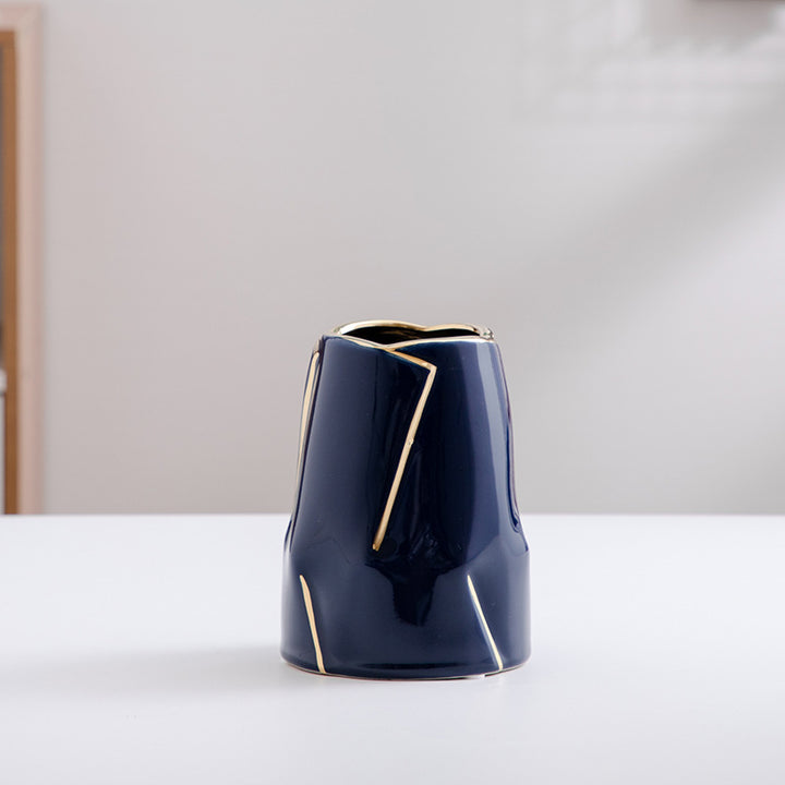 Decorative ceramic vase with golden accents