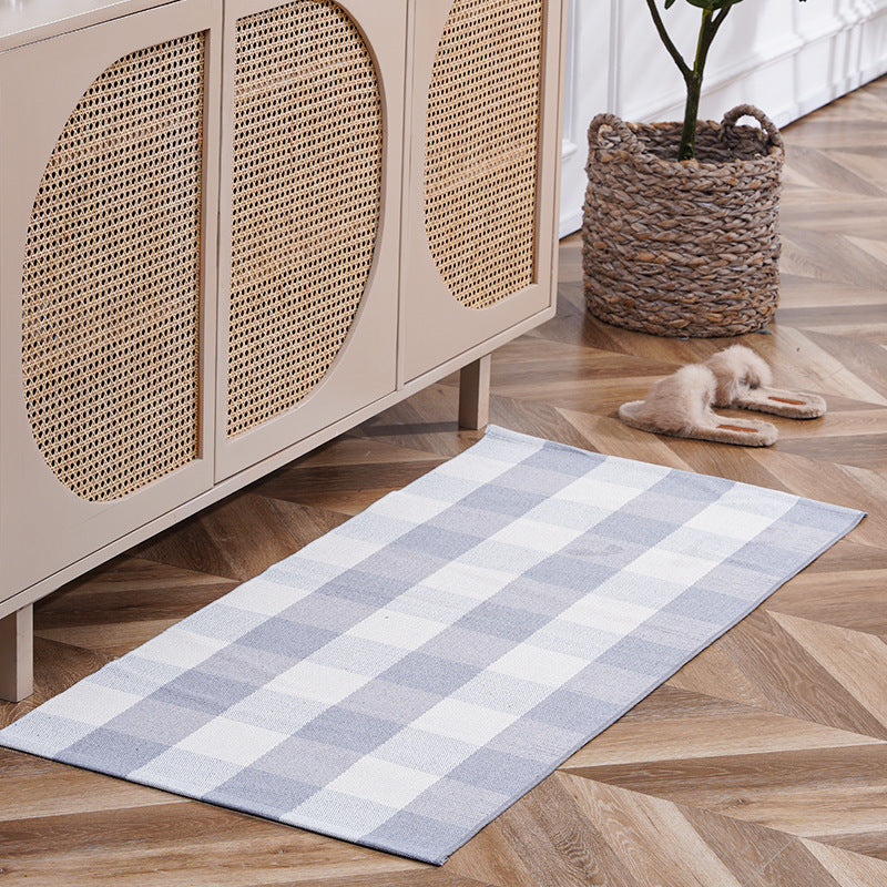 Flat-woven runner rug with check pattern and decorative border stripe