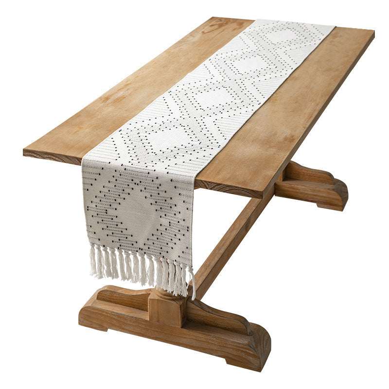 Handwoven table runner made of cotton blend with fringes and geometric dot jacquard