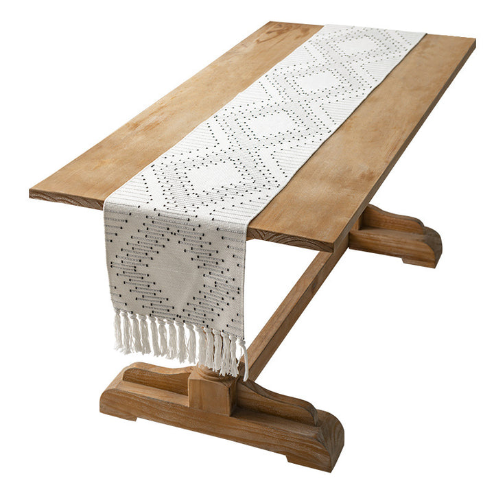 Handwoven table runner made of cotton blend with fringes and geometric dot jacquard
