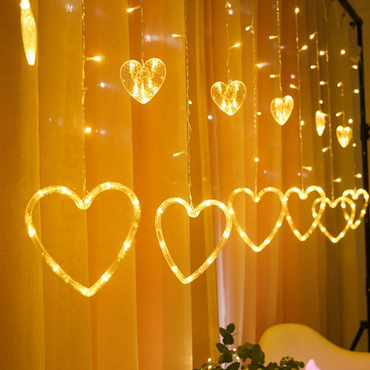 Hanging star and crescent moon LED curtain string lights for bedroom ambiance