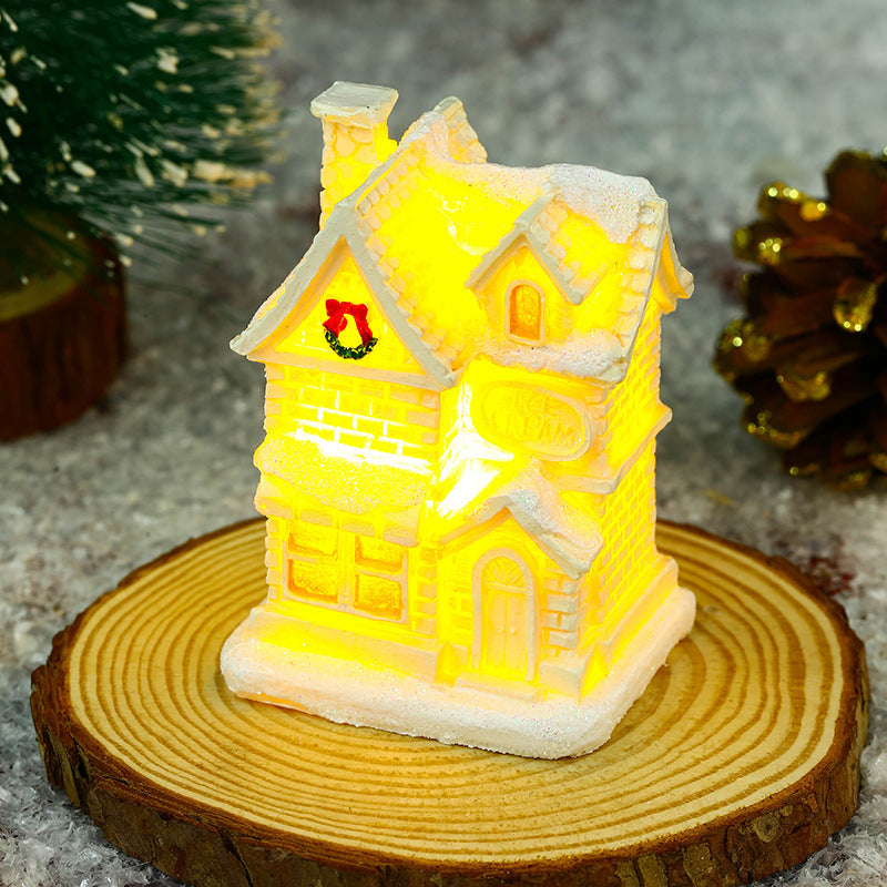 Illuminated Christmas village house with festive decoration