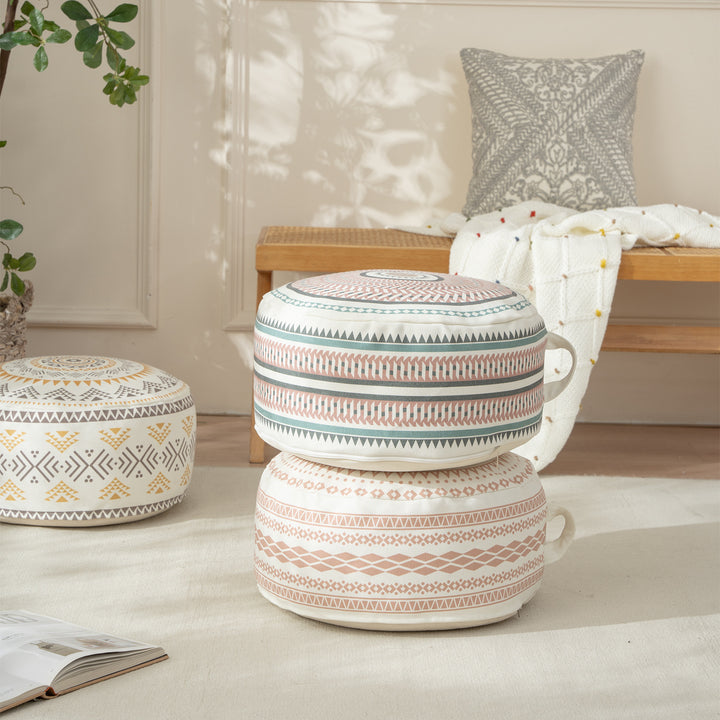 Round padded floor seat pouf with woven ethnic pattern and carrying handle