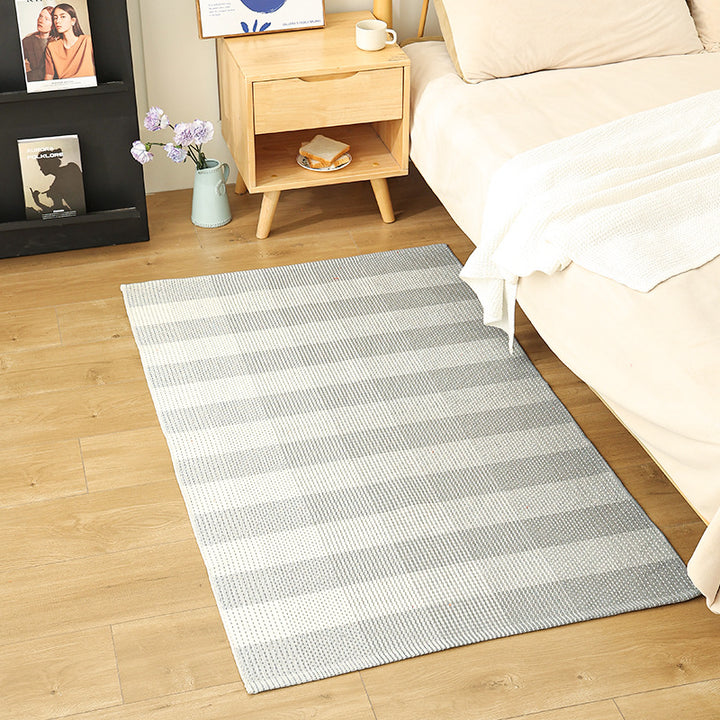 Modern flat-weave area rug with contrasting stripes and non-slip underside