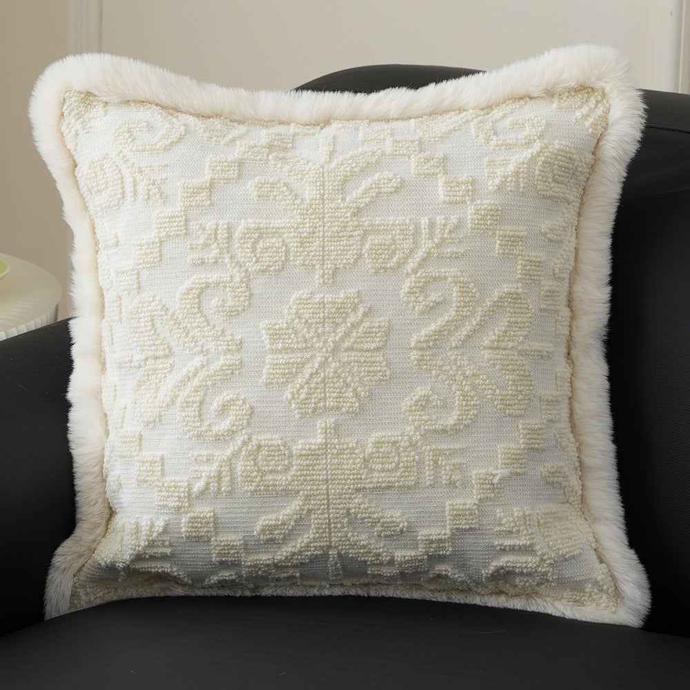 Square decorative pillow with embossed circular relief and soft faux fur edging