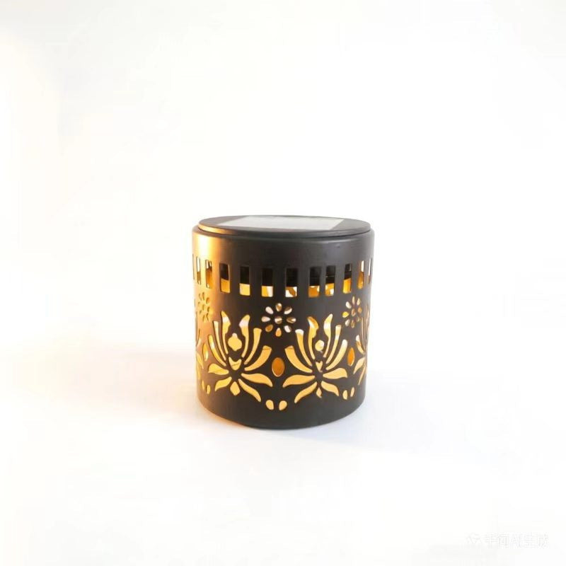 Decorative filigree metal tealight lantern with reflective inner lining