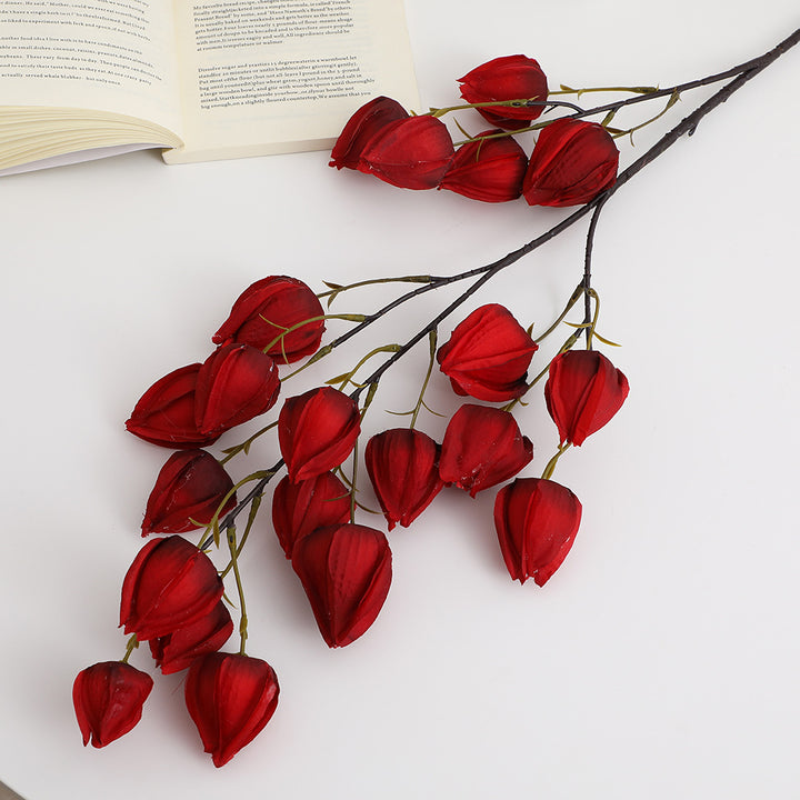 Artificial flower branch with vibrant flowers