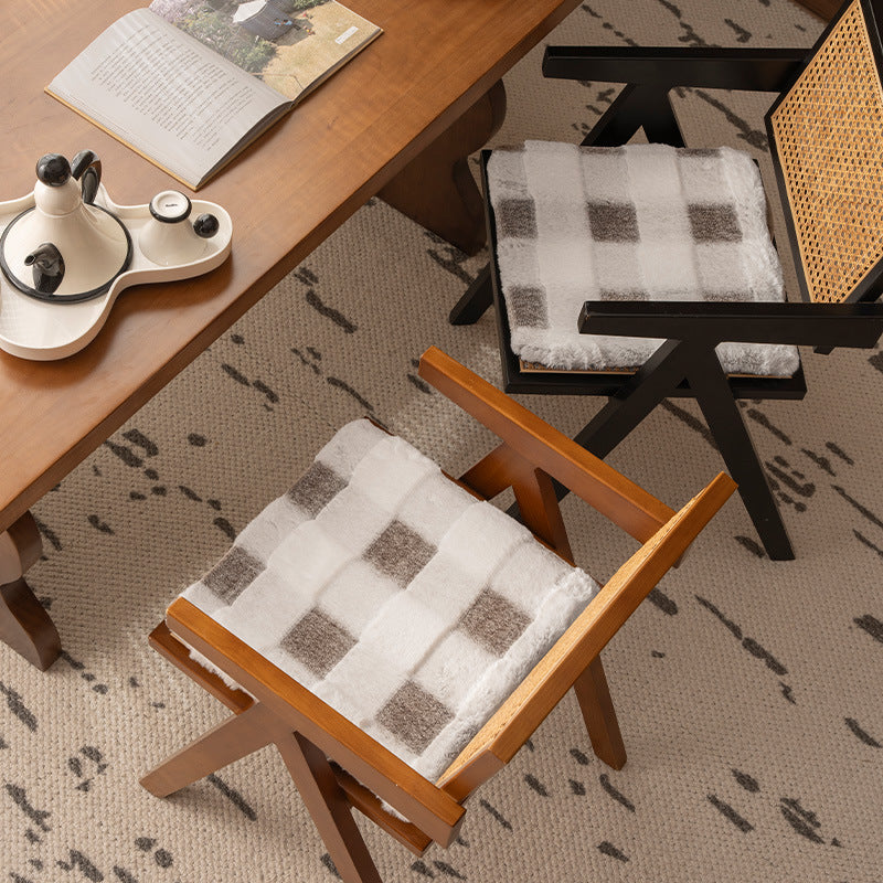 Padded seat cushion with faux fur cover and fastening straps
