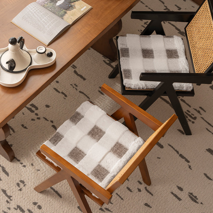 Padded seat cushion with faux fur cover and fastening straps