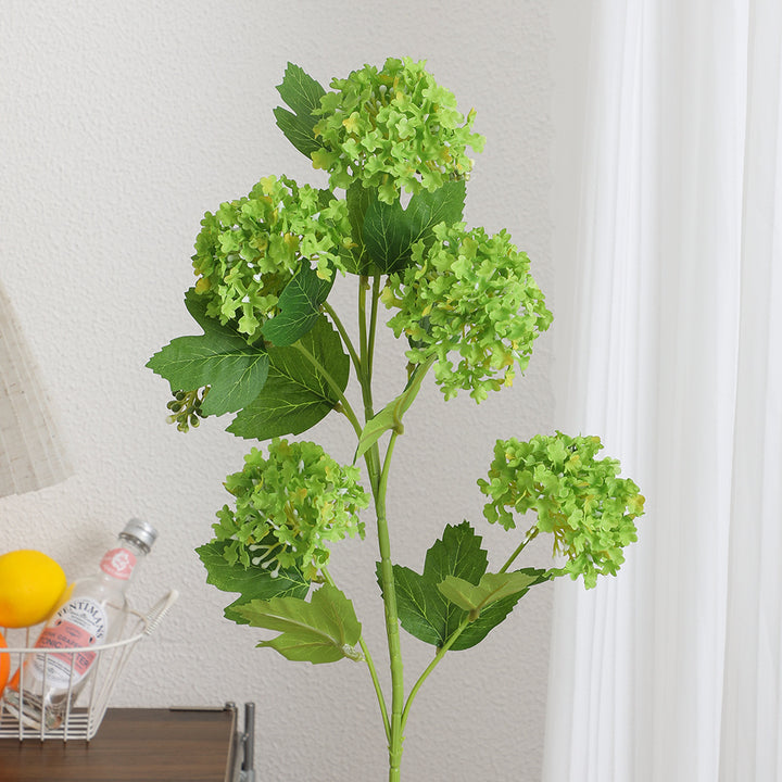Artificial hydrangea branch with vibrant flowers and detailed leaves