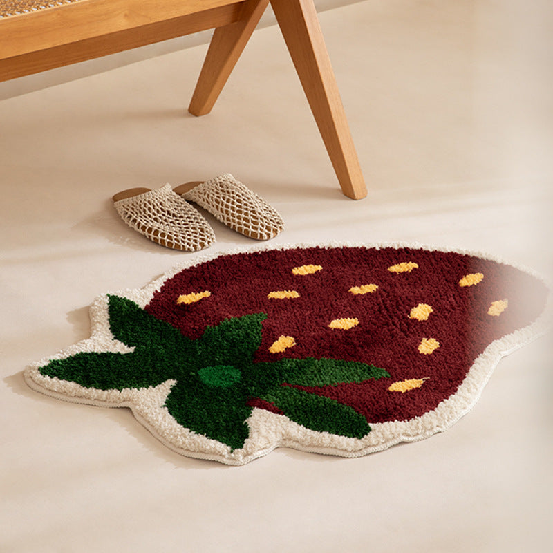 Playful hand-tufted strawberry mat made of dense cotton blend