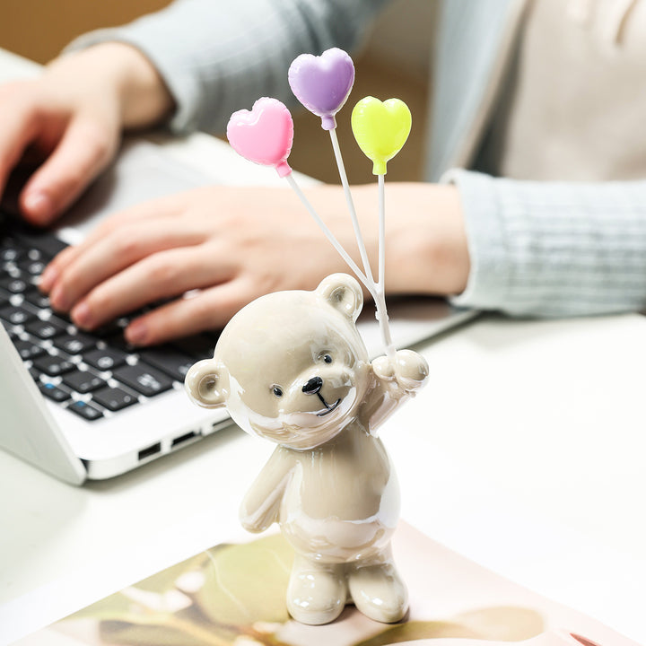 Cute ceramic bear figurine with balloons