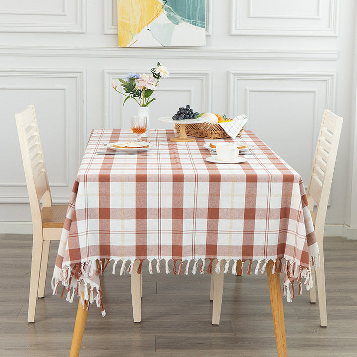 Rectangular checked cotton tablecloth with decorative fringes and light linen finish