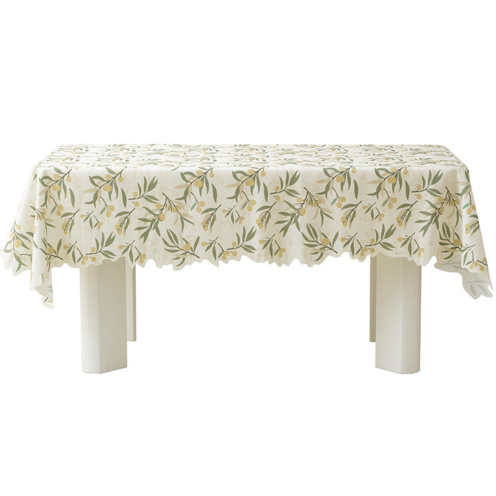 Round wipeable tablecloth with floral cut-out hem