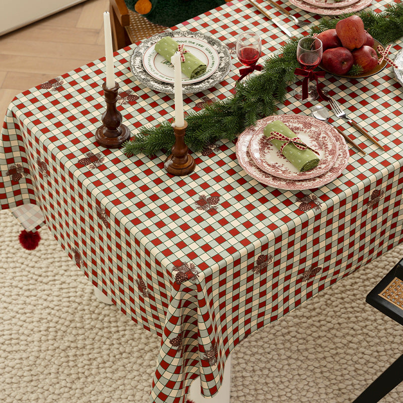 Rectangular decorative tablecloth with checkered pattern, pompom trim, and fine embroidered applique