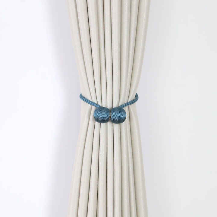 Decorative curtain tieback