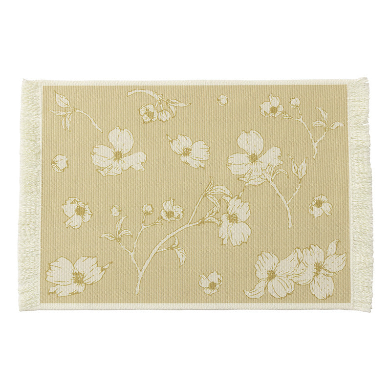 Floral woven bath mat with decorative fringes