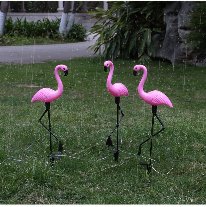 Decorative solar-powered flamingo garden stake with adjustable tray and spike attachment