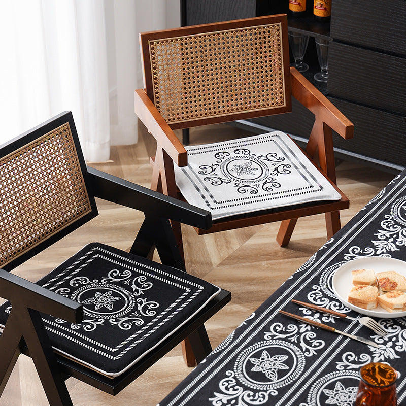 Double-sided seat cushion with ties and decorative jacquard pattern