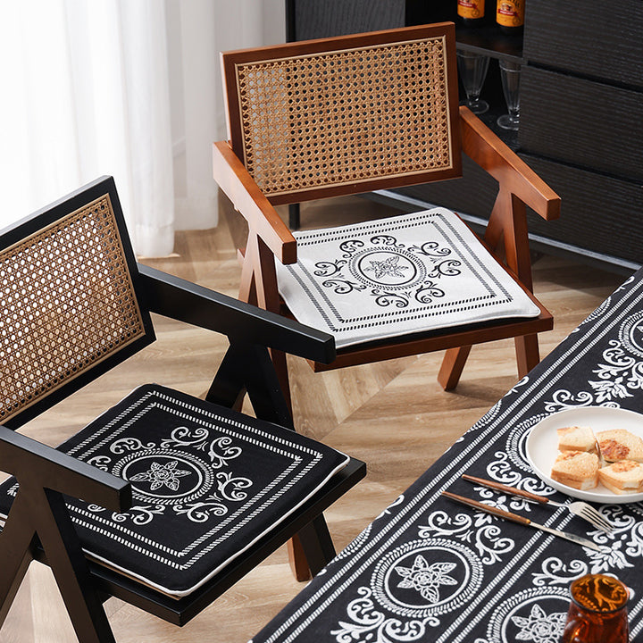 Double-sided seat cushion with ties and decorative jacquard pattern