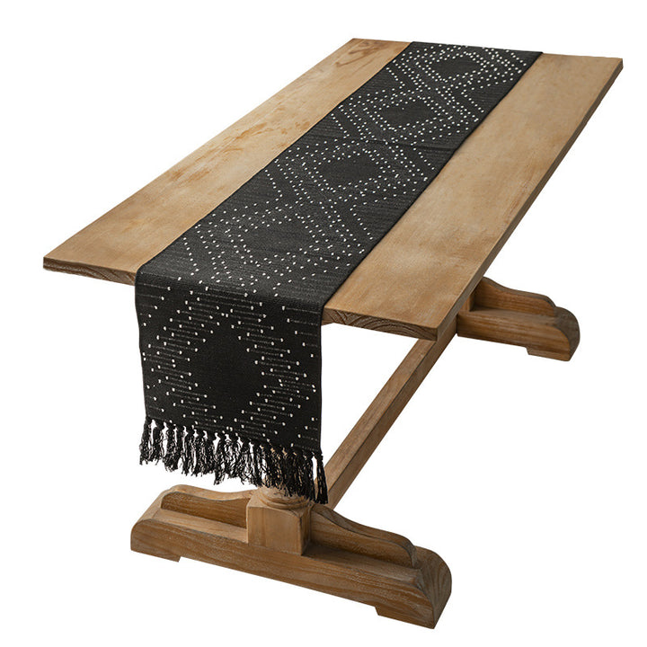 Handwoven table runner made of cotton blend with fringes and geometric dot jacquard