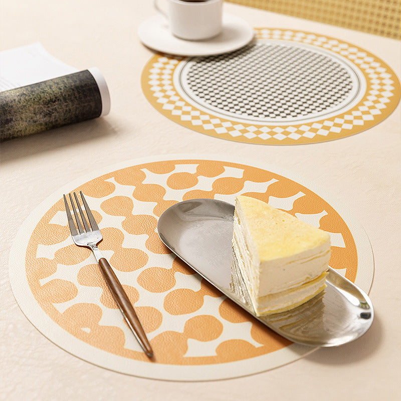 Round wipeable table mat made of PVC with non-slip back and retro geometric pattern