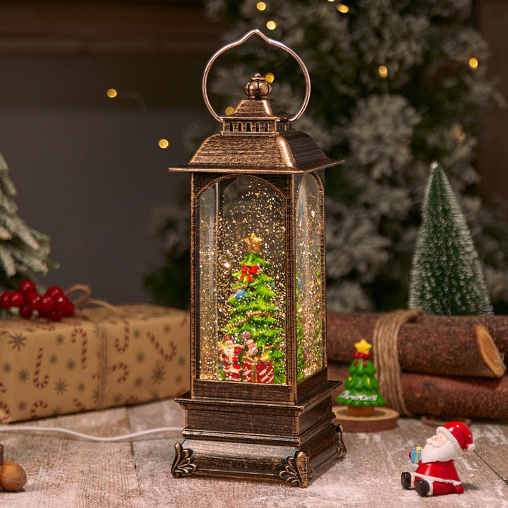 Illuminated Christmas lantern with snow and Christmas motif