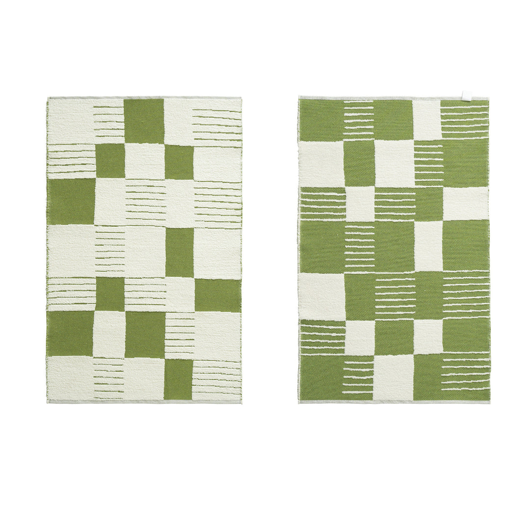 Modern runner rug with graphic checkerboard pattern and short pile structure