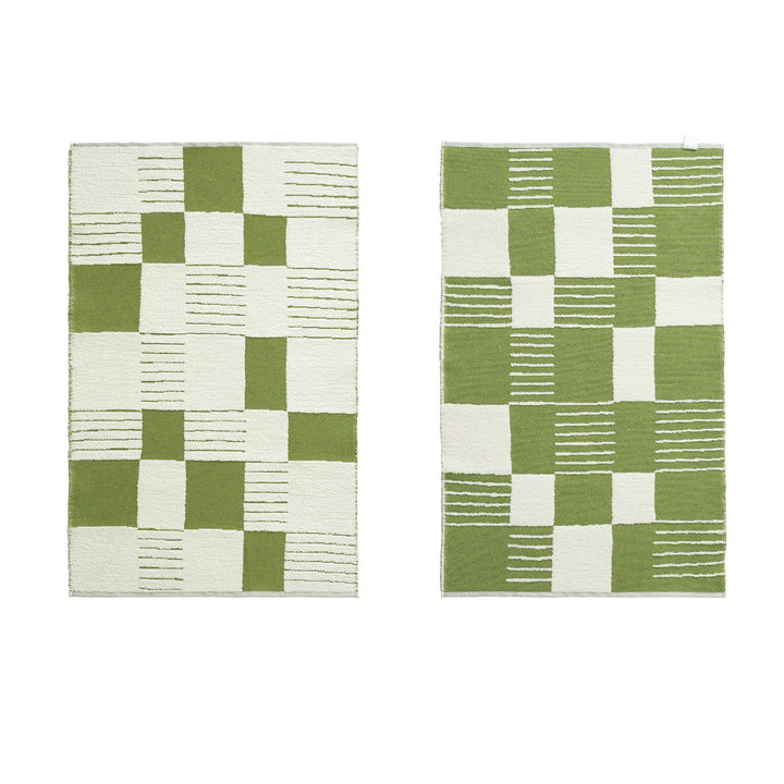 Modern runner rug with graphic checkerboard pattern and short pile structure