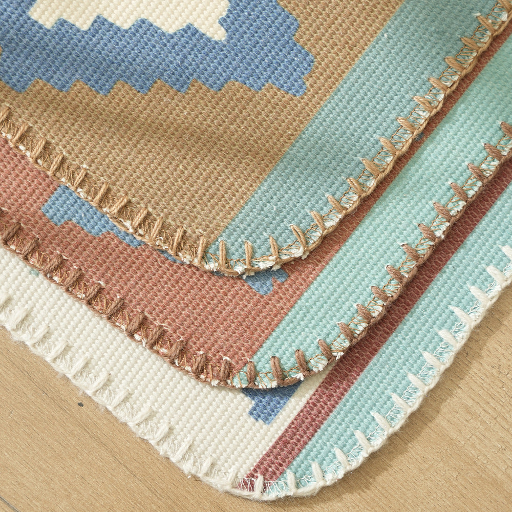 Woven runner rug in ethnic kilim pattern with flat weave structure and non-slip backing