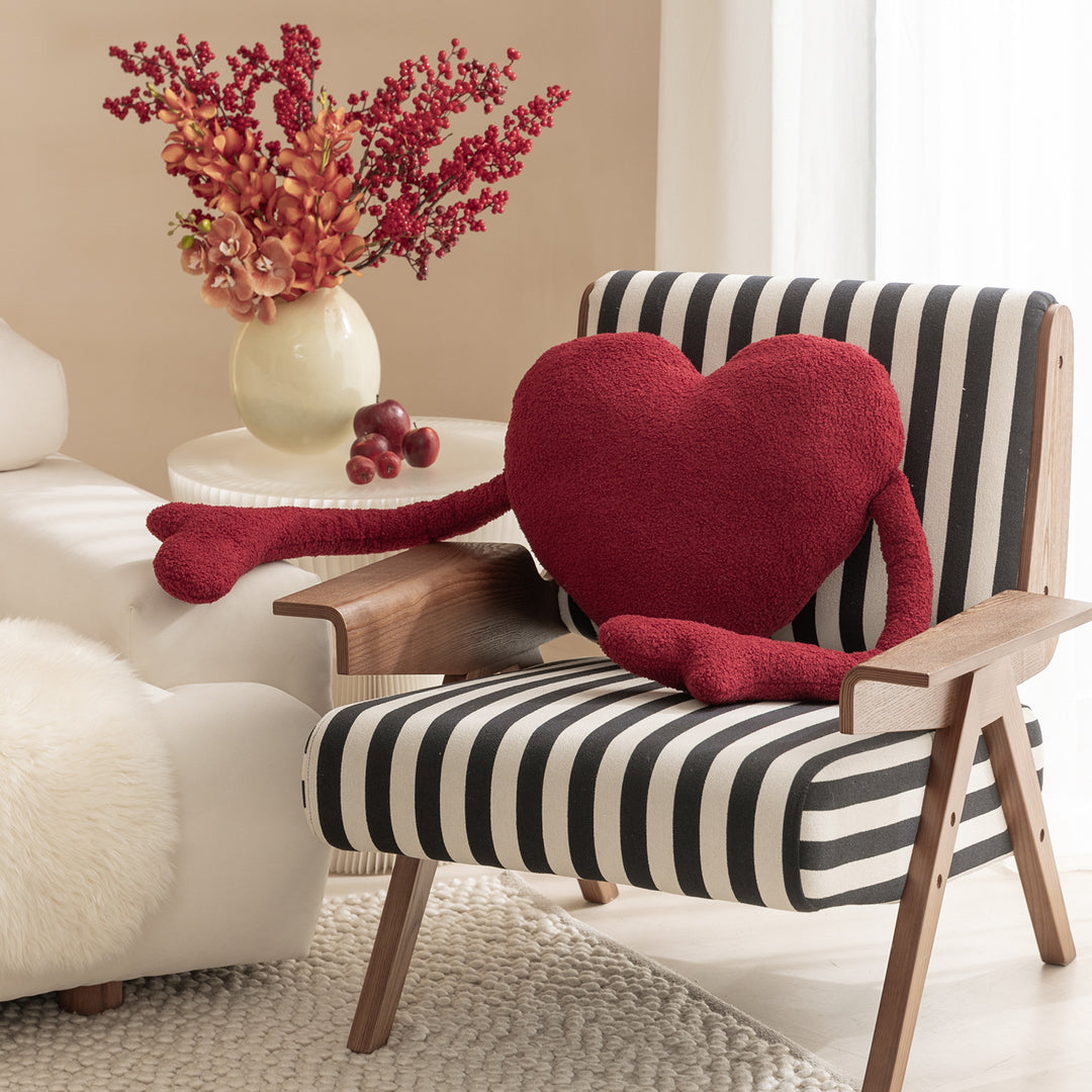 Heart-shaped cuddle cushion with extended arm applications