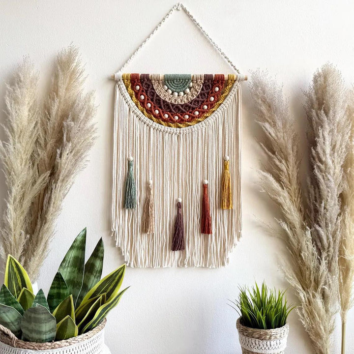 Artistic macrame wall hanging with colorful tassels and decorative elements