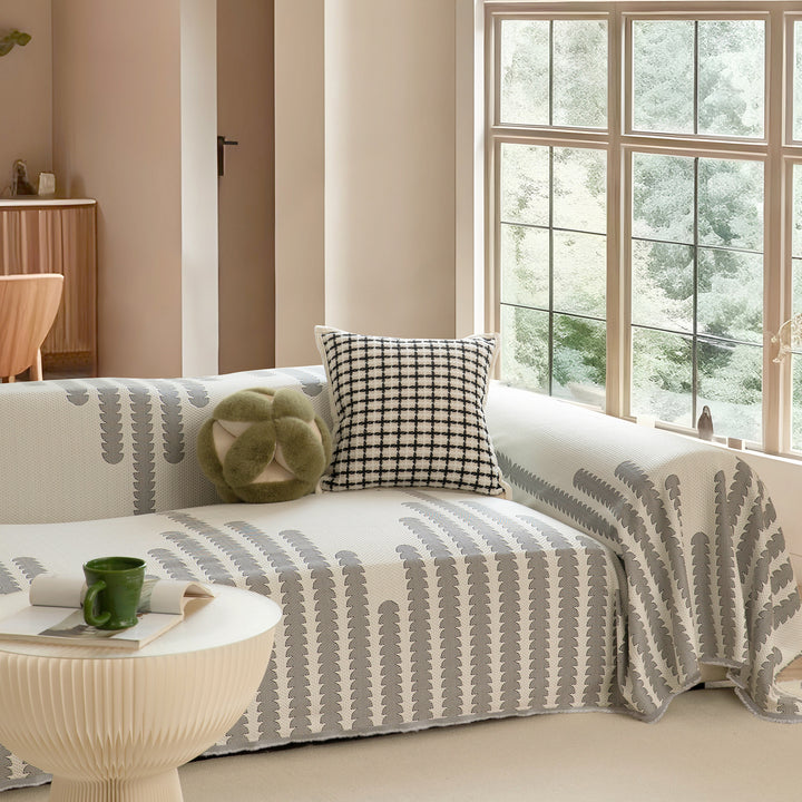 Elastic sofa cover made of jacquard cotton blend fabric with graphic relief pattern