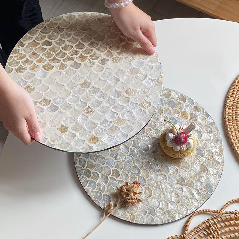 Round serving board made from noble shells