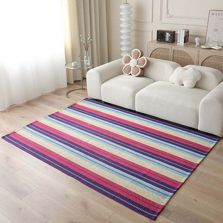 Woven living area rug with large check pattern and flat cotton texture