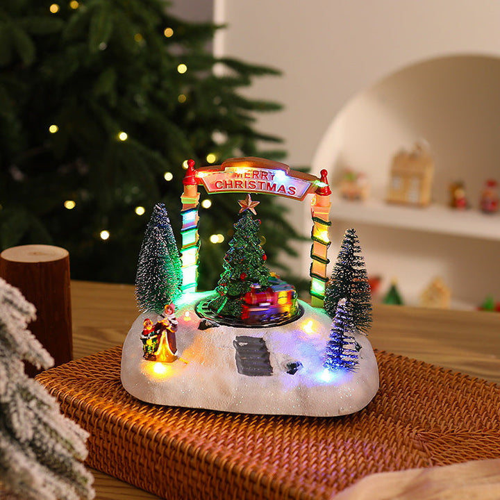 Illuminated Christmas village decoration with moving figures