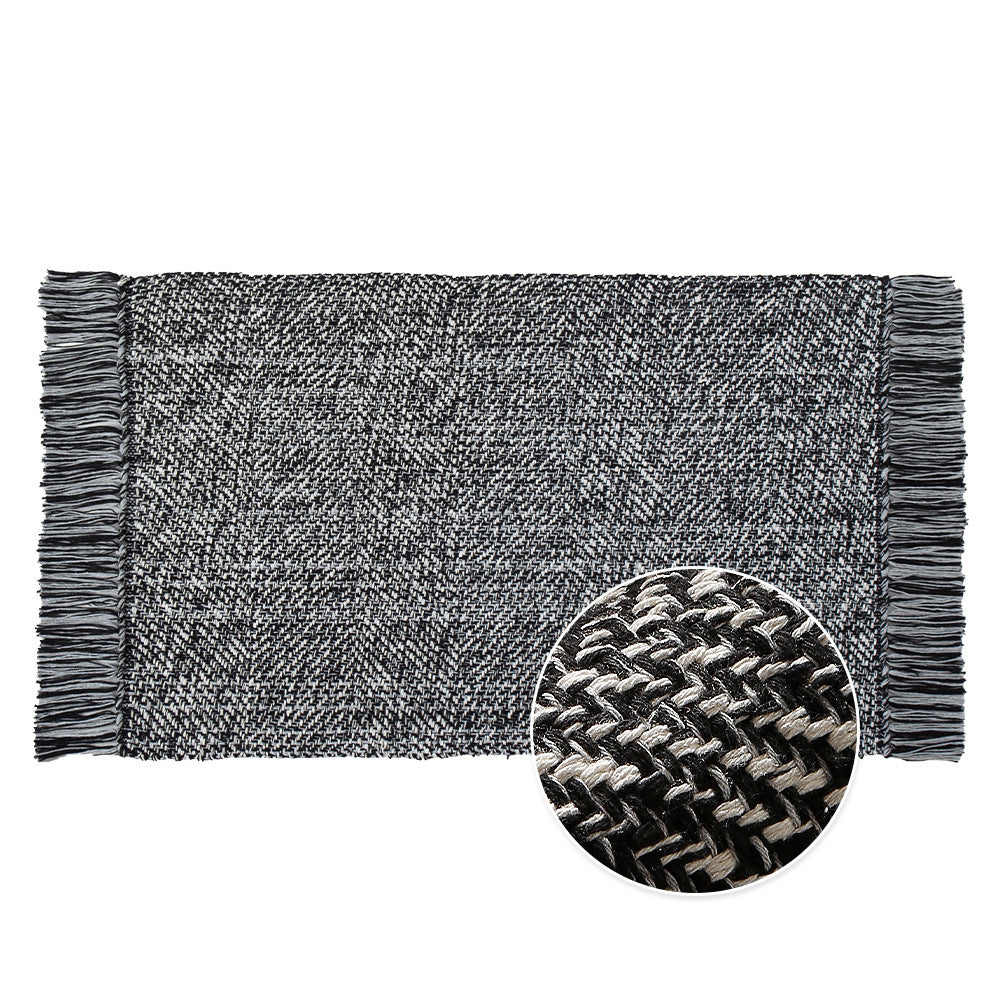 Woven table runner made of cotton blend with fine structure and herringbone look as well as decorative fringes