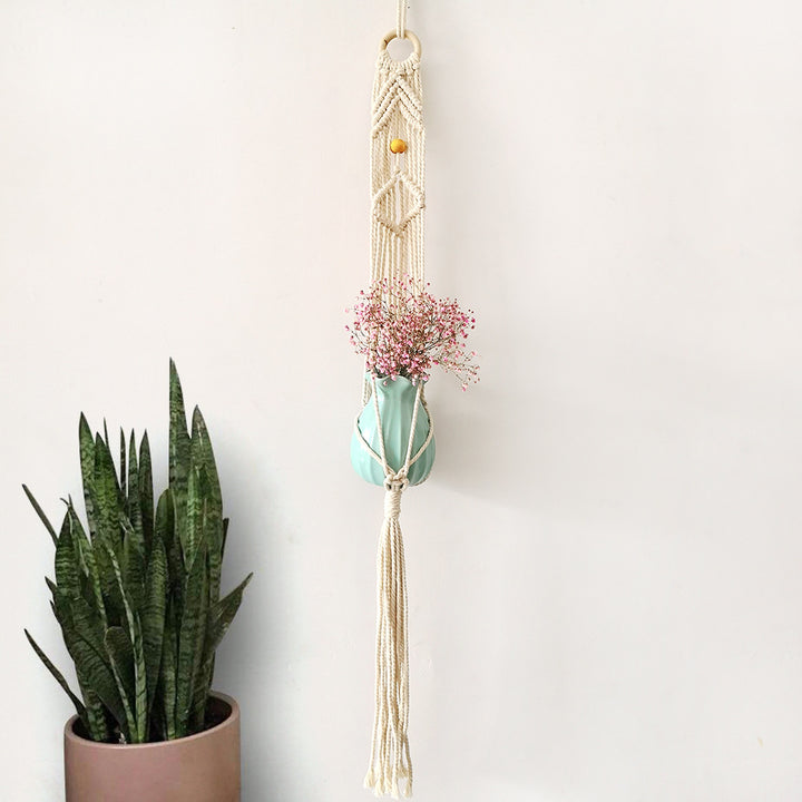 Macrame plant hanger with decorative tassels