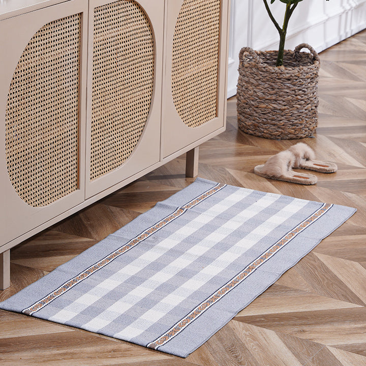 Flat-woven runner rug with check pattern and decorative border stripe
