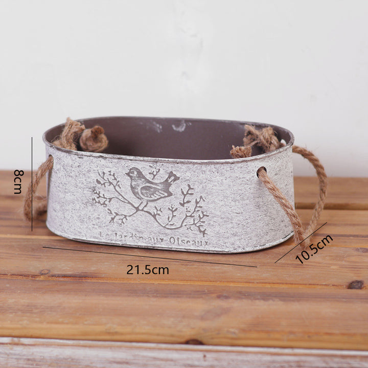 Decorative storage basket made of metal with natural design