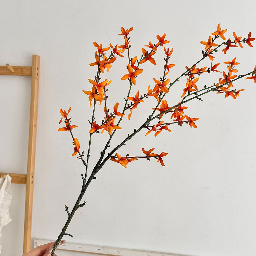 Artificial flower branch with intricately detailed yellow flowers
