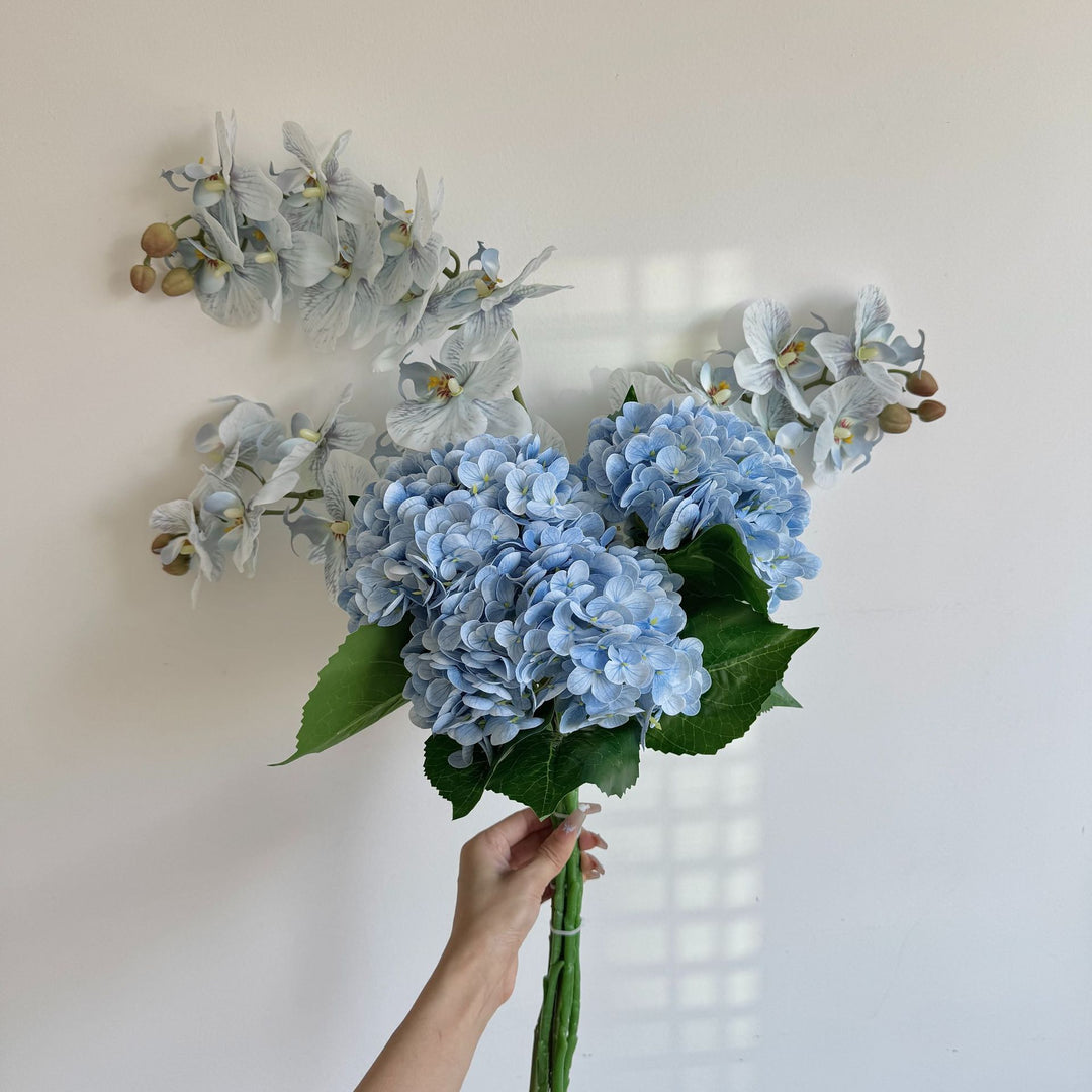 Luxurious artificial flower bouquet with blooming orchids